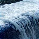 Close-up of a car being carefully washed