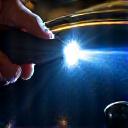 Inspector checking the final paint finish with a light